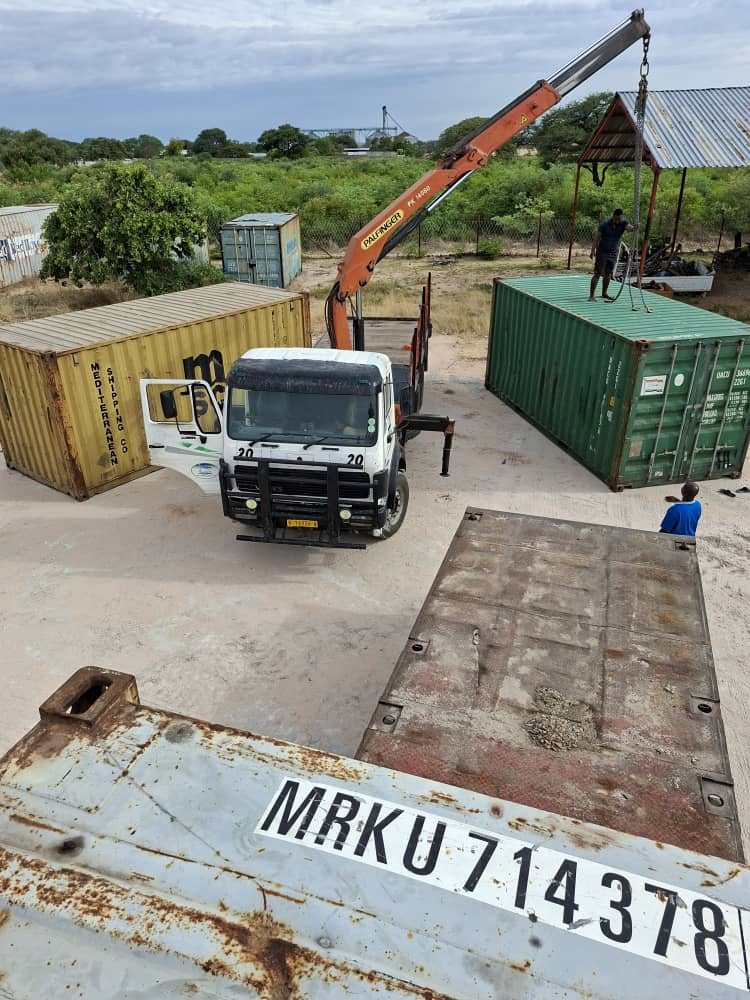 Containers delivered by crane truck