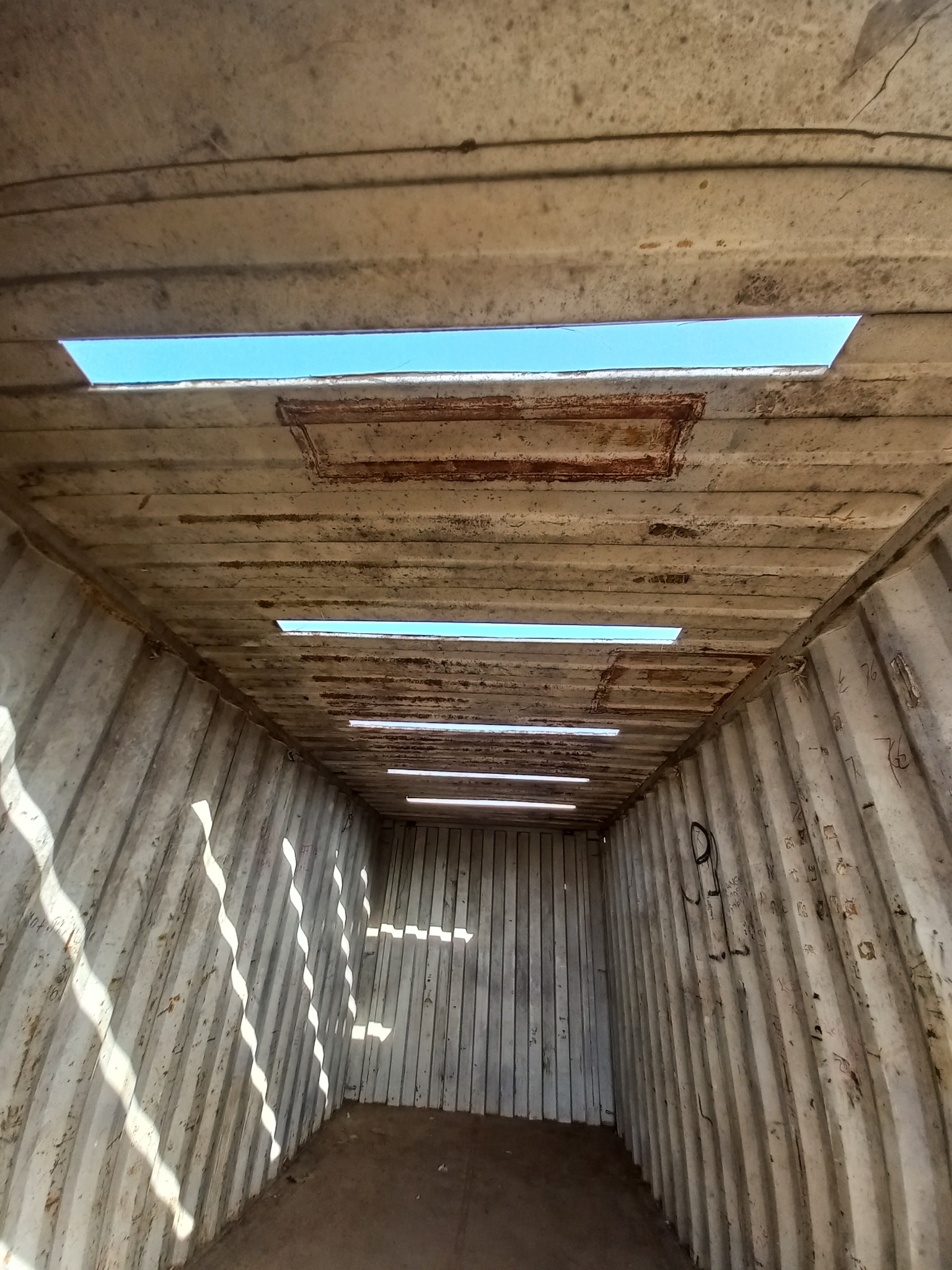 Container roof before repair